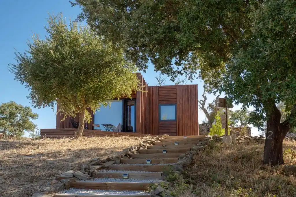 Wooden bungalow nestled among Alentejo trees